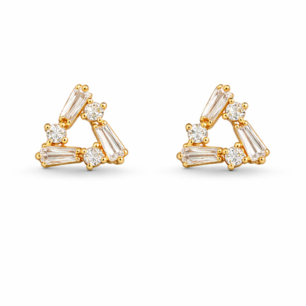 A pair of gold-plated triangle stud earrings for women featuring a mix of baguette and round-cut crystals, shown on a clean white background.