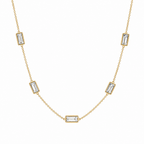 A gold-plated stainless steel chain for women featuring five bezel-set baguette-cut crystal stations