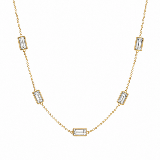 A gold-plated stainless steel chain for women featuring five bezel-set baguette-cut crystal stations