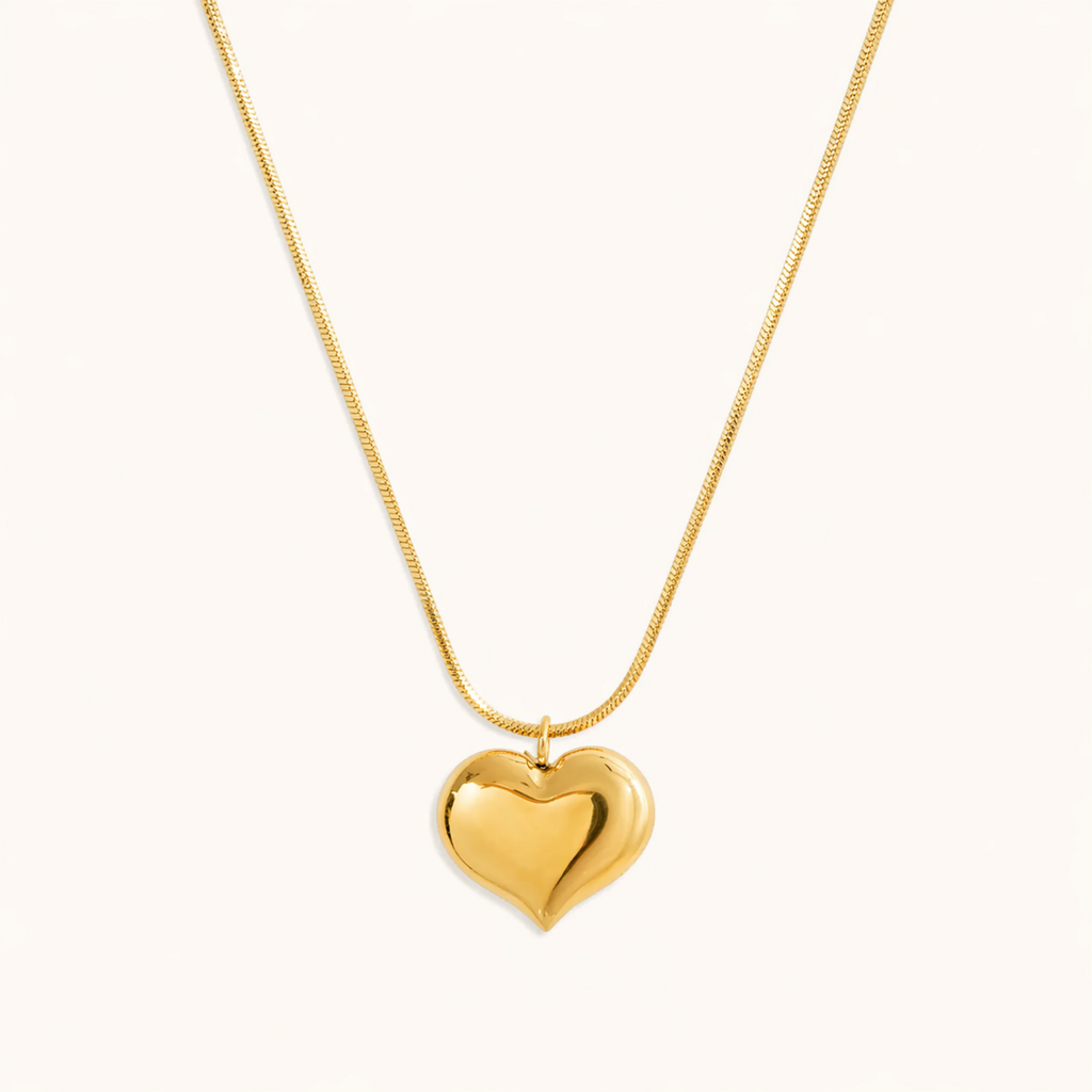 A gold-plated stainless steel chain for women featuring a small, polished 3D puffed heart pendant on a delicate link chain