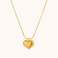 A gold-plated stainless steel chain for women featuring a small, polished 3D puffed heart pendant on a delicate link chain