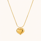 A gold-plated stainless steel chain for women featuring a small, polished 3D puffed heart pendant on a delicate link chain