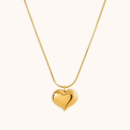 A gold-plated stainless steel chain for women featuring a small, polished 3D puffed heart pendant on a delicate link chain