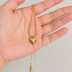 A gold-plated stainless steel chain for women featuring a small, polished 3D puffed heart pendant on a delicate link chain