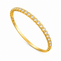 A gold-plated eternity bracelet for women featuring a continuous row of bezel-set round crystals and a secure side-clasp.