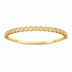 A gold-plated eternity bracelet for women featuring a continuous row of bezel-set round crystals and a secure side-clasp.