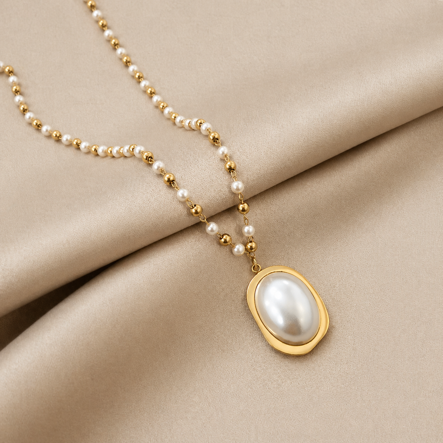 A gold-plated stainless steel chain for women featuring alternating pearls and gold beads with a large oval pearl pendant