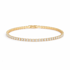 A gold-plated adjustable tennis bracelet for women on a white background
