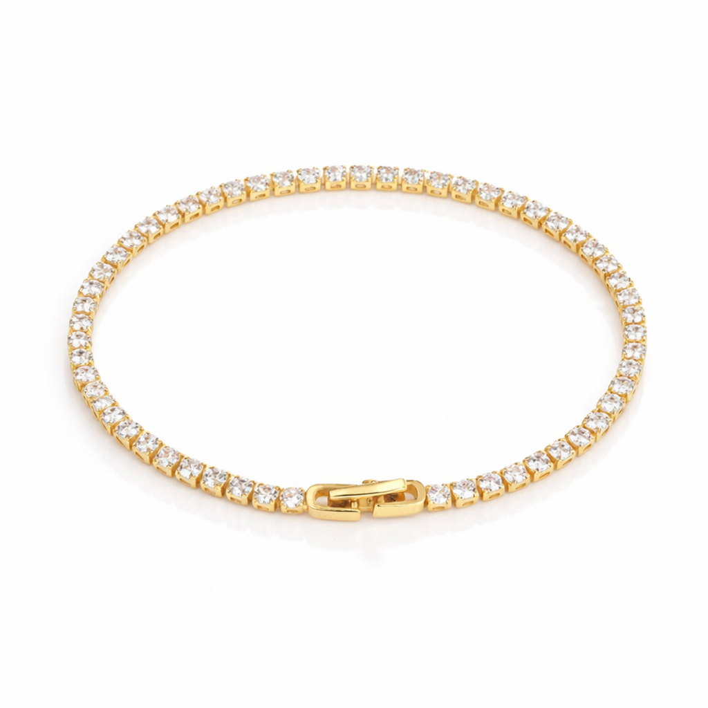 A gold-plated adjustable tennis bracelet for women on a white background