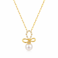 A gold-plated stainless steel chain for women featuring a crystal-encrusted bow pendant with a large white pearl drop, isolated on a white background