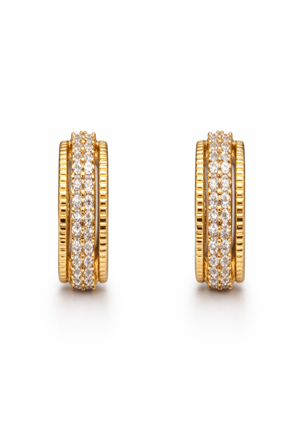 A pair of gold-plated textured hoop earrings for women featuring a central row of clear crystals and ridged outer bands, on a white background
