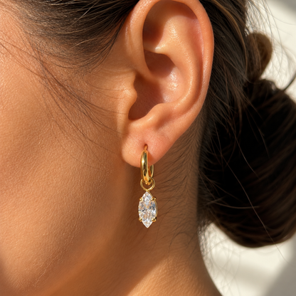 Marielle crystal drop hoop earrings with marquise-cut clear crystals in gold on a model