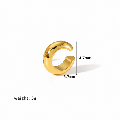 Gold-tone open ear cuff with a smooth rounded band and a row of clear crystals along the lower edge, with dimensions