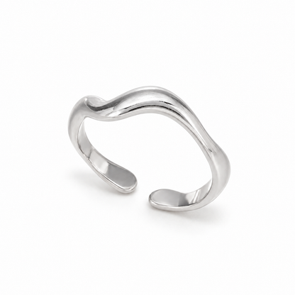 A close-view of a Sculpted Wave Adjustable Silver Ring for Women with Sculptural Open Band Design
