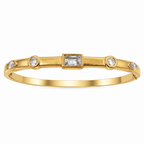 A close-view of a gold-plated bracelet for women featuring crystal inlays, organic textures, and modern geometric designs.