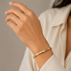 A gold-plated bracelet for women featuring crystal inlays, organic textures, and modern geometric designs.