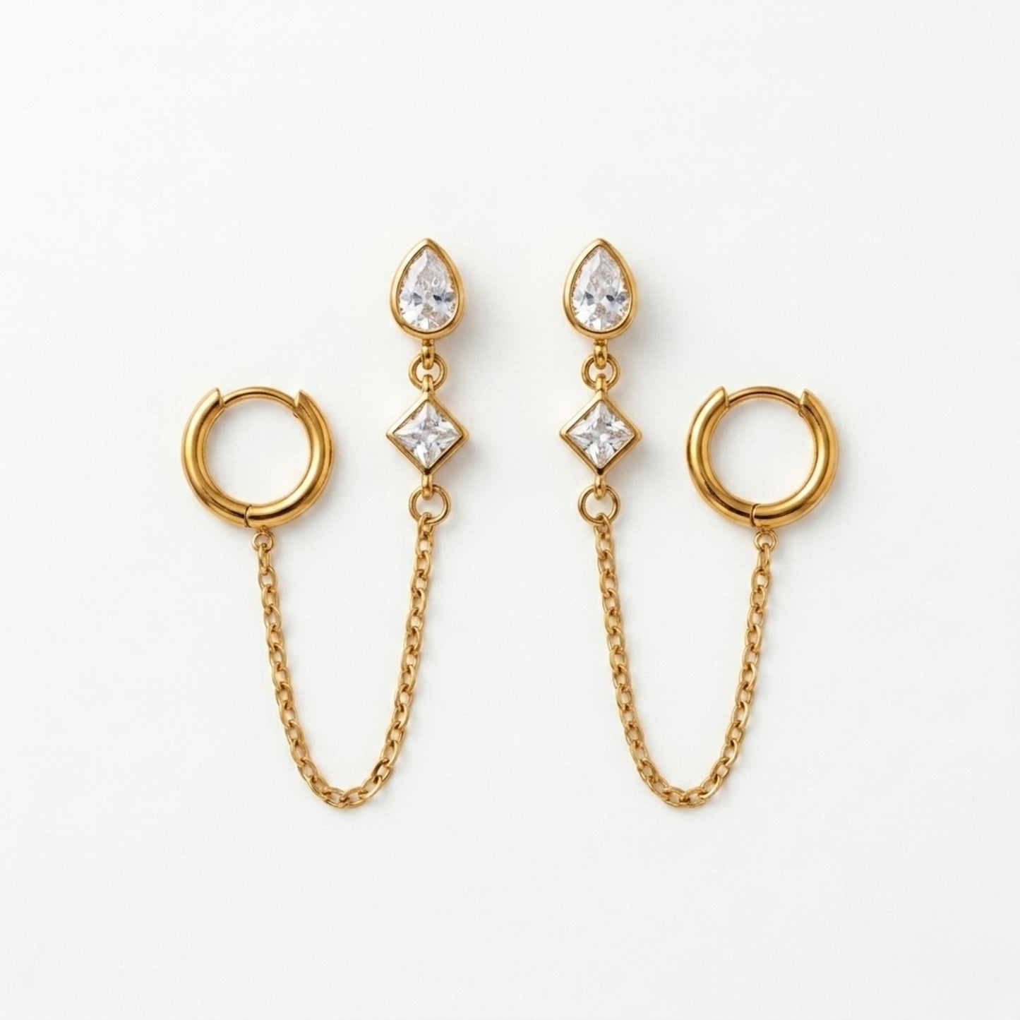 A pair of gold-plated ear chain earrings for women connecting a tiered crystal drop stud to a small gold hoop with a fine chain.