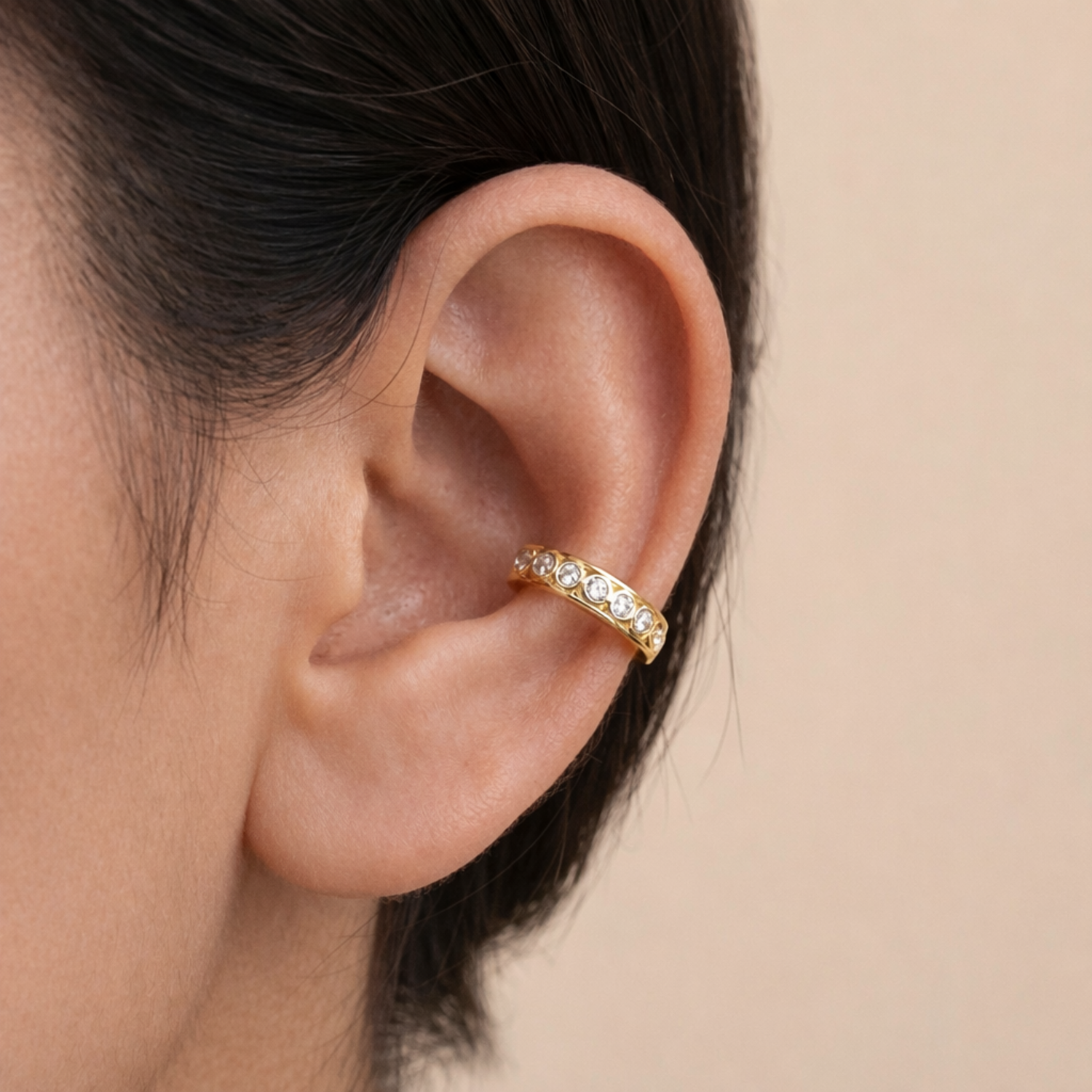 A gold-plated ear cuff earrings for women featuring a braided gold rope band  on a model