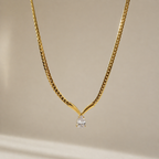 A gold-plated stainless steel chain for women featuring a V-shaped mounting and a large sparkling teardrop crystal pendant