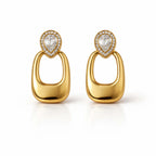 A pair of gold-plated long earrings for women featuring a pear-cut crystal halo stud and a large, smooth rectangular golden drop.