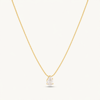 A gold-plated stainless steel chain for women featuring a single, brilliant pear-cut crystal pendant on a delicate link chain.