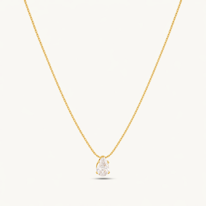 A gold-plated stainless steel chain for women featuring a single, brilliant pear-cut crystal pendant on a delicate link chain.