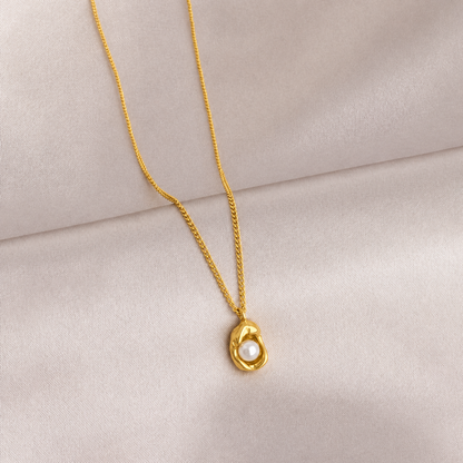 A gold-plated stainless steel chain for women featuring an organic, molten-gold pendant set with a single white pearl