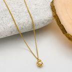 A gold-plated stainless steel chain for women featuring an organic, molten-gold pendant set with a single white pearl