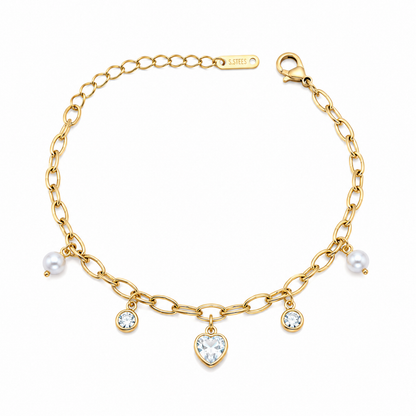 A gold-plated chain bracelet for women featuring dangling pearl charms, round crystals, and a central heart-shaped crystal pendant.