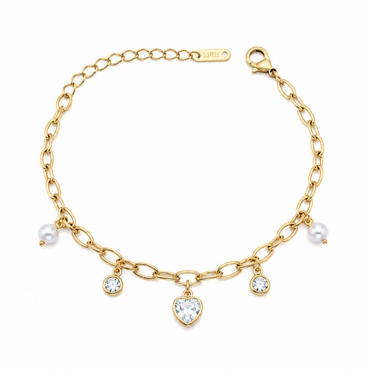 A gold-plated chain bracelet for women featuring dangling pearl charms, round crystals, and a central heart-shaped crystal pendant.