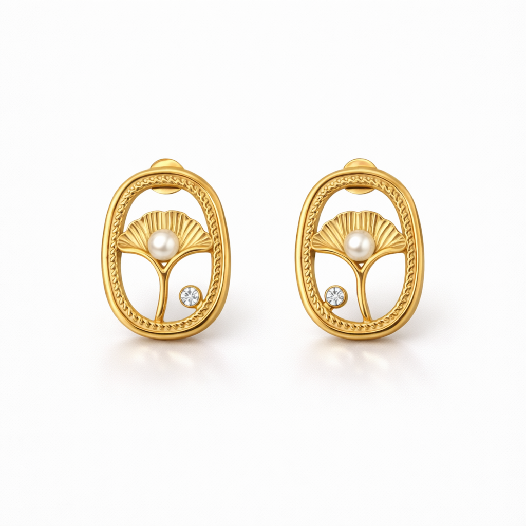 A pair of gold-plated oval stud earrings for women featuring an shell design with a central pearl and a small crystal, shown on a white background.