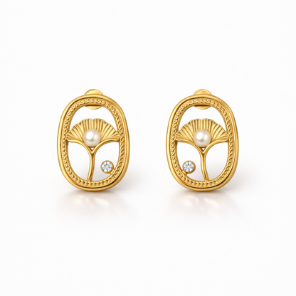 A pair of gold-plated oval stud earrings for women featuring an shell design with a central pearl and a small crystal, shown on a white background.