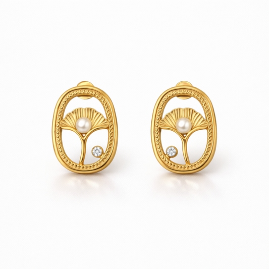 A pair of gold-plated oval stud earrings for women featuring an shell design with a central pearl and a small crystal, shown on a white background.