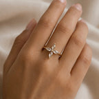 A close view of delicate gold plated adjustable ring for women featuring a four-petal flower design