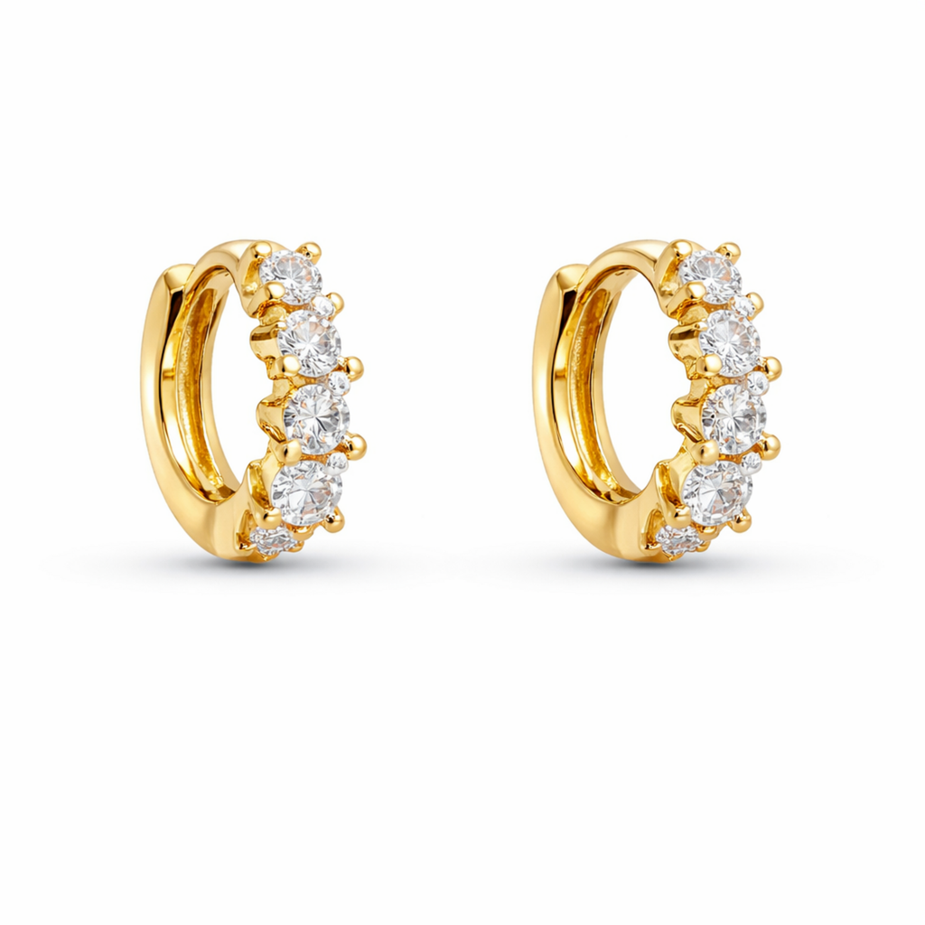 A pair of gold-plated hoop earrings for women featuring a row of five brilliant clear crystals, shown on a clean white background.