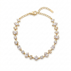A gold-plated chain bracelet for women featuring a variety of stone cuts including round, marquise, and emerald shapes on a white background.