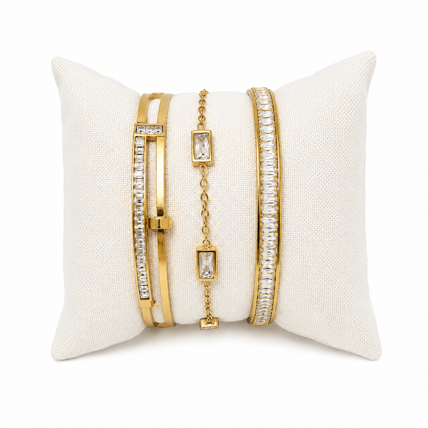 A premium three-piece gold-plated bracelet stack for women featuring two geometric crystal station bangles and a central multi-cut crystal statement chain bracelet.