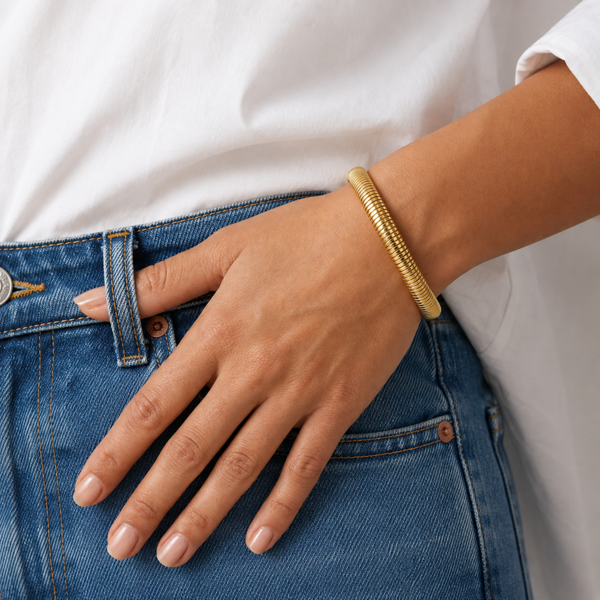 18K gold plated ribbed snake chain bangle for women with a sleek polished finish and anti-tarnish design on a model