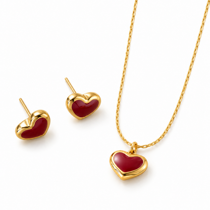 heart necklace and matching earrings set with deep red heart accents and gold-plated details.
