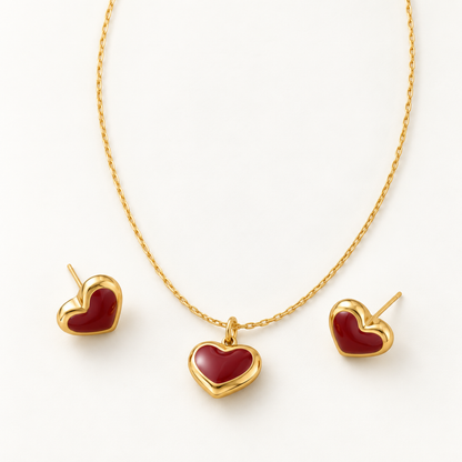 heart necklace and matching earrings set with deep red heart accents and polished gold-plated.