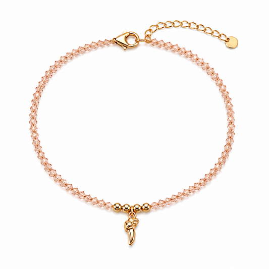 A rose-toned crystal chain bracelet for women featuring a gold talon charm and polished golden beads