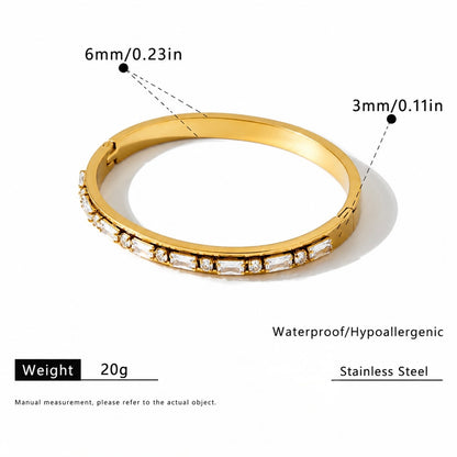 Gold-toned stainless steel bangle bracelet with clear rectangular stones, shown on a white background with measurement callouts (6mm/0.23in and 3mm/0.