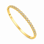 A close-view of a gold-plated bracelet for women featuring a continuous row of bezel-set crystals and a secure side clasp.