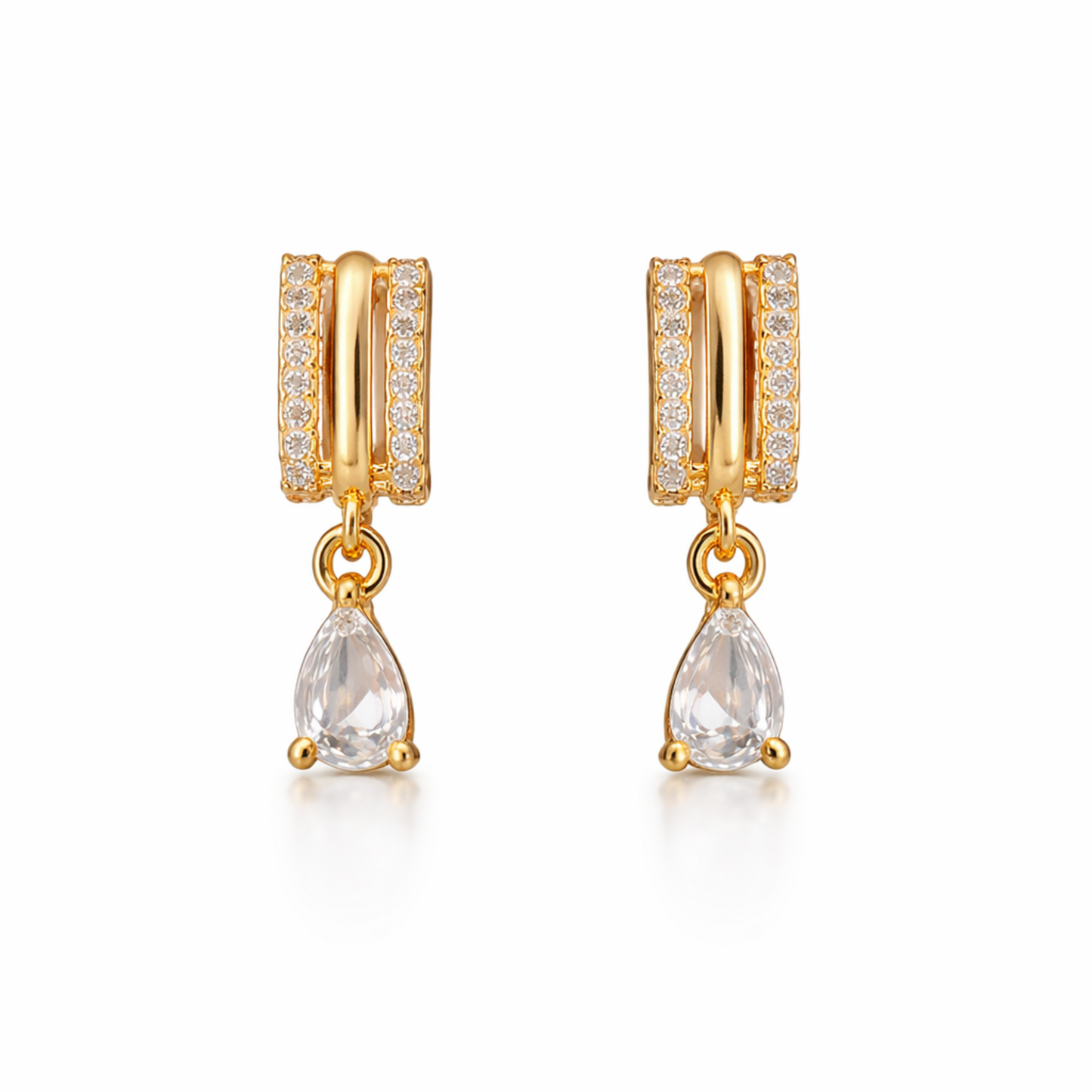 A pair of gold-plated huggie hoop earrings for women featuring a suspended clear pear-shaped crystal drop, shown on a clean white background.