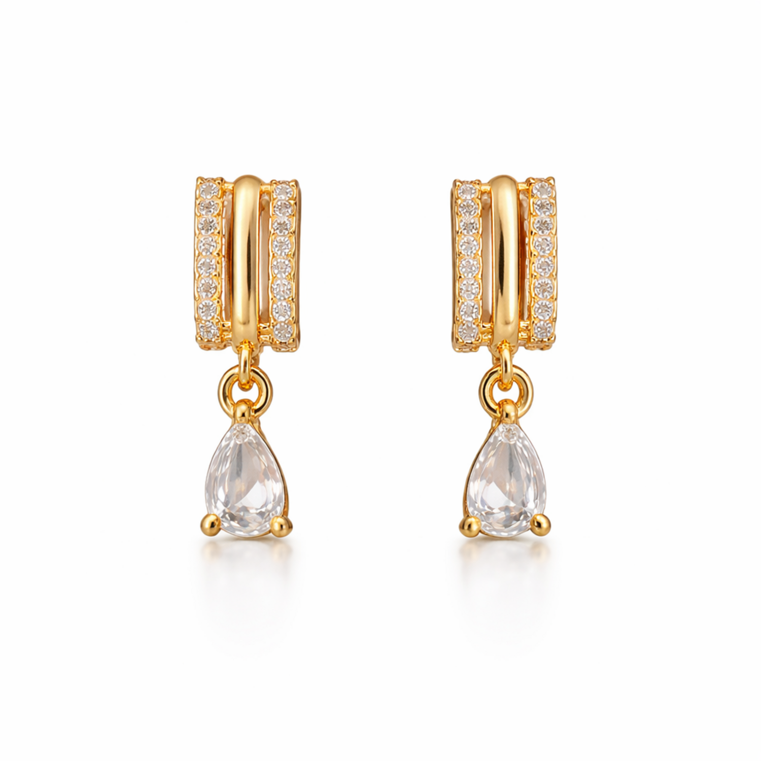 A pair of gold-plated huggie hoop earrings for women featuring a suspended clear pear-shaped crystal drop, shown on a clean white background.