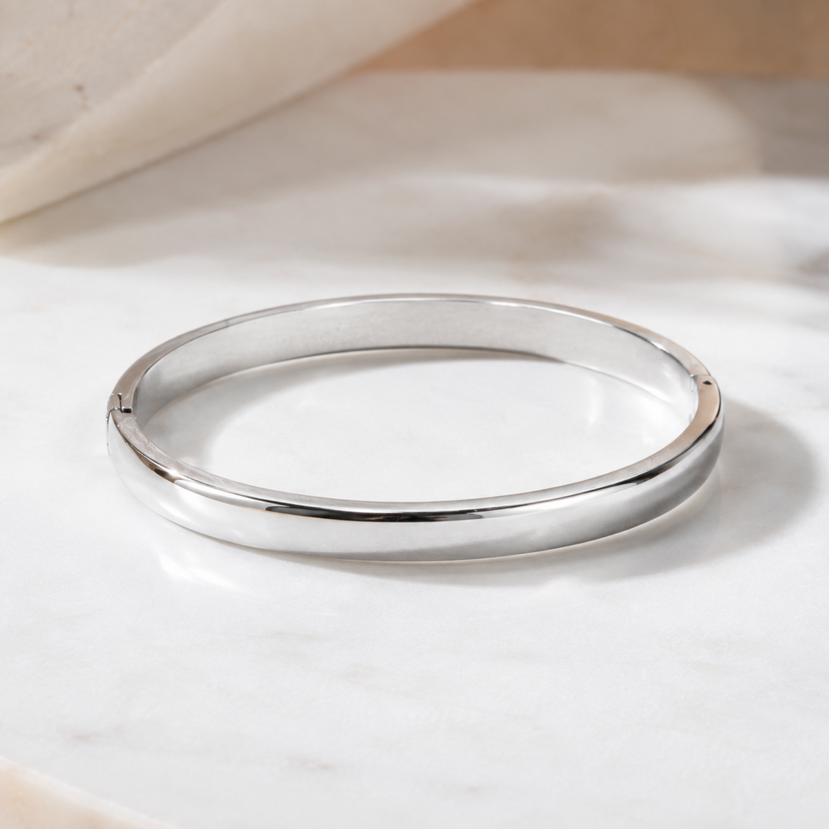 silver plated minimalist dome bangle bracelet for women with a smooth polished finish