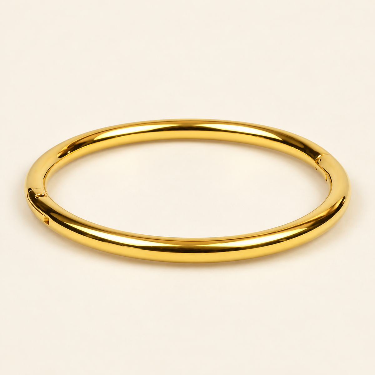 Minimal Gold Bangle Bracelet with a smooth, rounded band and polished gold-plated finish.