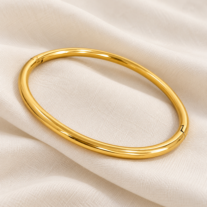 Minimal Gold Bangle Bracelet with a smooth, rounded band and polished gold-plated finish.