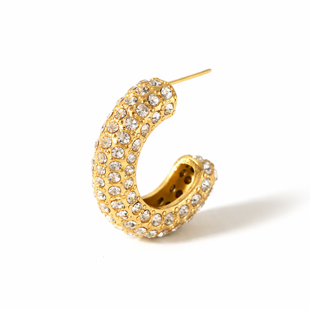 A close-view of a gold-plated hoop earrings for women featuring a prominent princess-cut clear crystal and smaller round accents