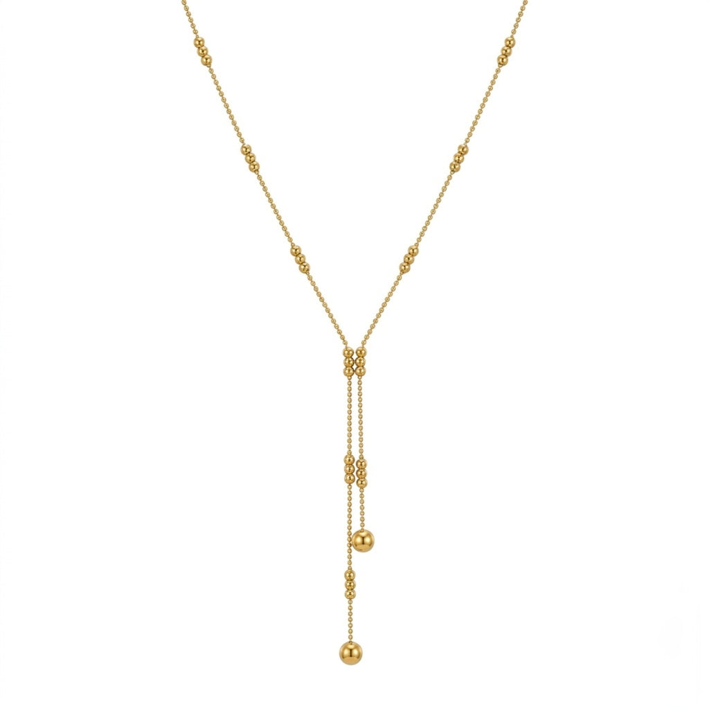 A gold-plated stainless steel chain for women featuring a double-strand Y-drop lariat design with gold beads